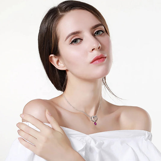 Double Heart Necklace ESF0003-2 on someone's neck- Tan Tan Gallery