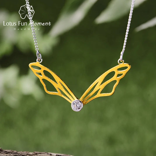 Hollow Butterfly Wings Necklace LFJF0063B gold color with a blurry background- Tan Tan Gallery