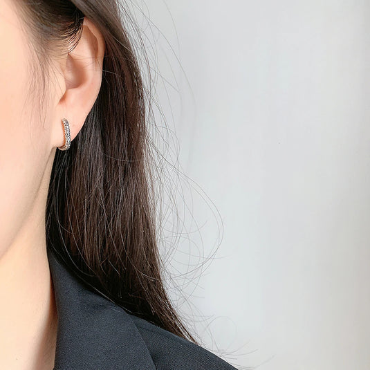 Silver Ellipse Earring SA0178P on someone's ear - Tan Tan Gallery