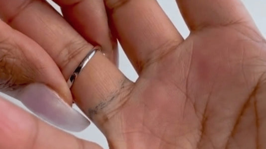 green tarnish on a man's hand because of a silver ring